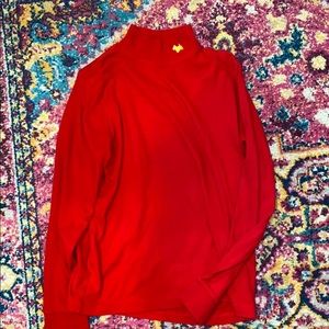 Red turtle neck with little gold dog on the neck